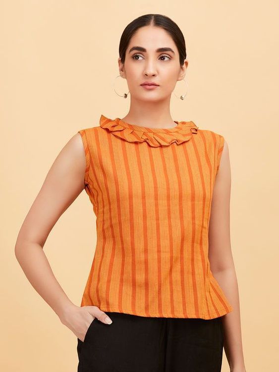 The Kurti Has A Collar And Is Teamed With Jeans